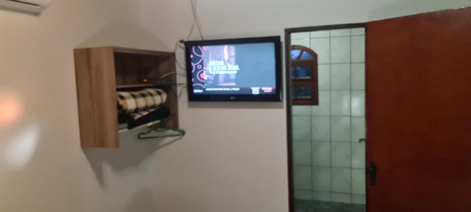 Pousada Nossa Senhora Penedo  Oda fotoğraf A television set in a hotel room