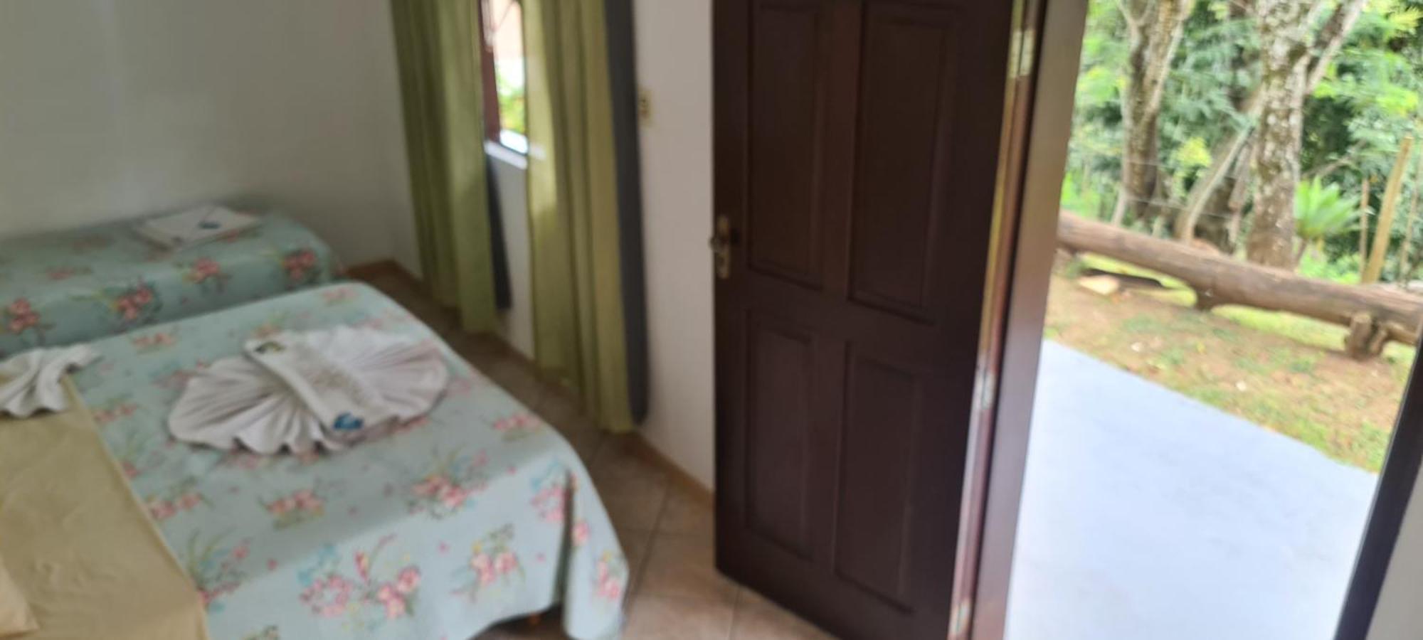 Pousada Nossa Senhora Penedo  Oda fotoğraf A bedroom in a house in Brazil